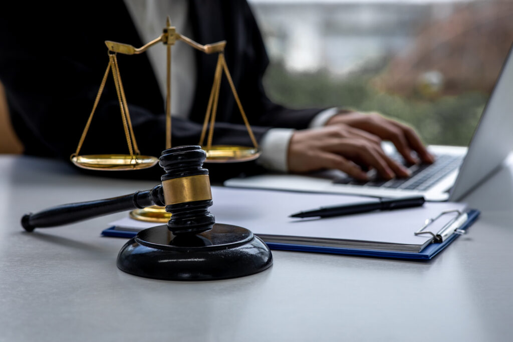 Scales of justice and gavel on a criminal lawyer's desk